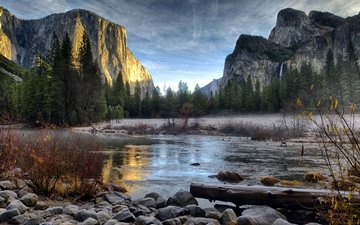 Merced River with frosted stones, El Capitan in sunset, late autumn