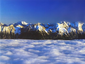 winter Alps, view from above the clouds