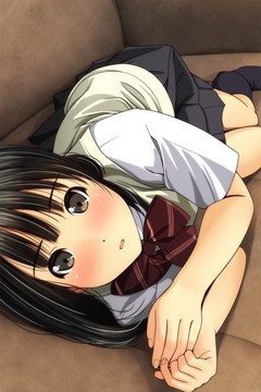 on her side on couch, blushing