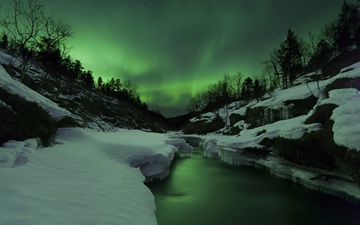 Aurora Borealis over Tennevik River, Troms, Norway (closer to the stream)