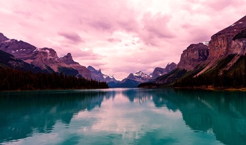 Maligne Lake under pink sky, Jasper NP, Alberta, Canada