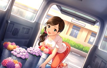 Etou Misaki with flowers in a van