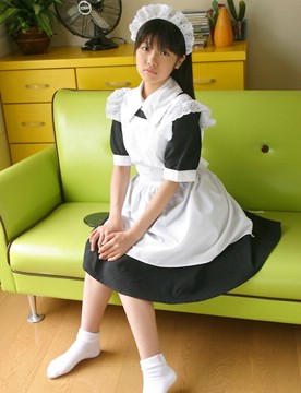 maid sitting on a lime couch