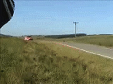 racing accident, car rolls in the air, gets wrecked