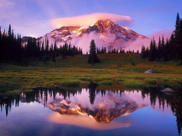 Mount Rainier and a lenticular cloud reflected at sunset, Washington, USA
