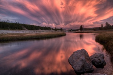 dramatic pink sunset clouds above the Firehole River, Yellowstone NP, Wyoming, USA (even later)