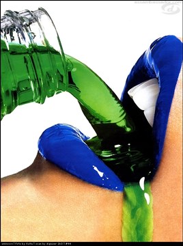 green bottled drink pouring in blue lips, overflowing